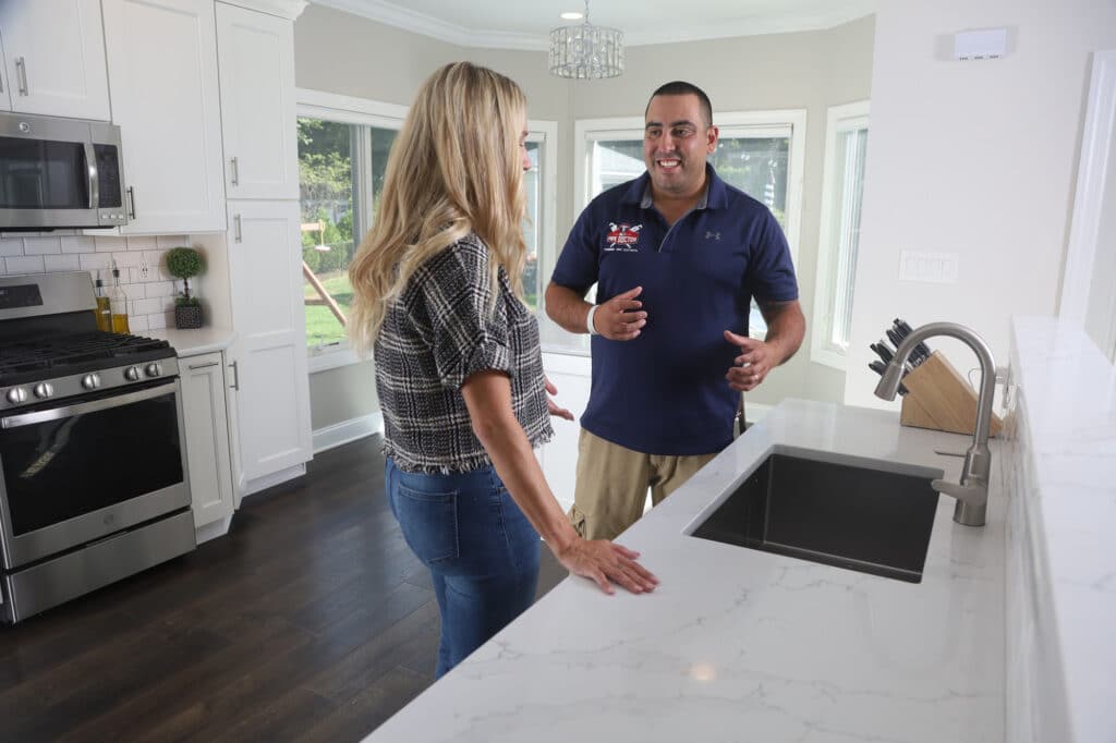 Image of NJ Pipe Dr plumber and HVAC tech in Rahway talking to a client in her home