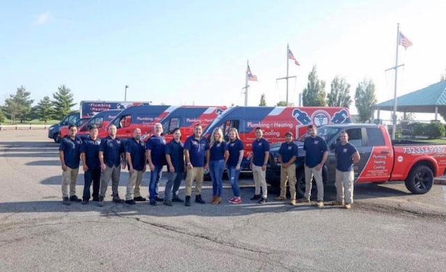NJ Pipe Dr team standing in front of vans for HVAC and plumbing services in Clark, NJ