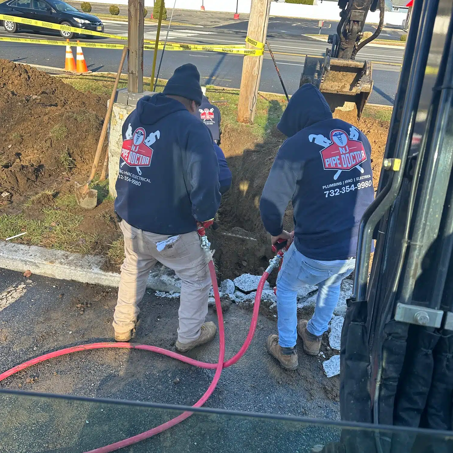 Image of NJ Pipe Dr techs working on sept tank in Woodbridge, NJ